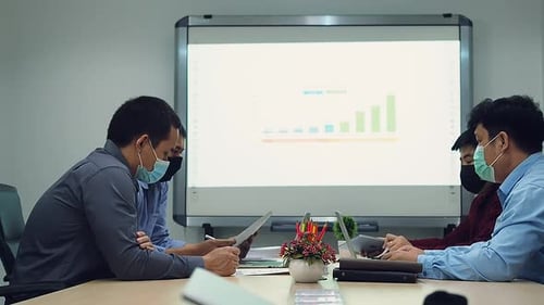 Team Collaboration Analyzing Data in Modern Office