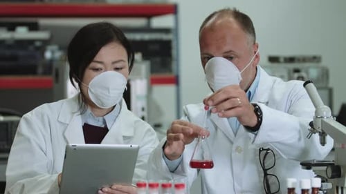 Scientists Conducting Experiment in Modern Laboratory