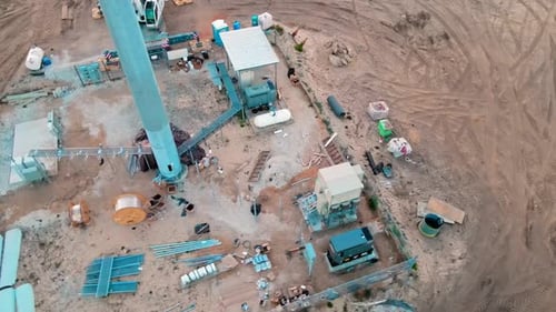 4k Drone video of the contruction site which is installing a cell tower with construction workers dr