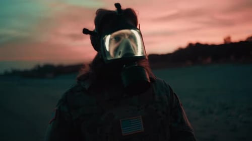 American Soldier Walks on Beach Wearing Gas Mask in Toxic Smog