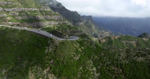 Cars Driving Through Dangerous Mountain Pass To Rocha do Navio Waterfall In Madeira, Portugal. - ae
