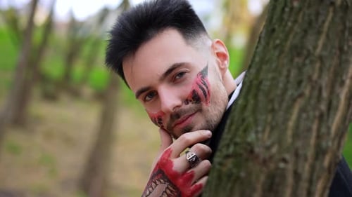 Adult With Face and Hand Drawings Posing