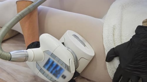 In Clinic Cosmetologist Uses Vacuum Roller Device with Manipulator to Perform Anticellulite Massage