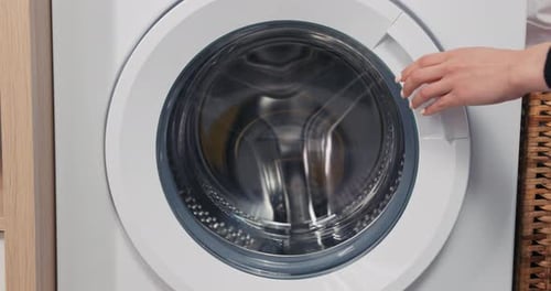 Opening Front Loading Washing Machine Door Close Up