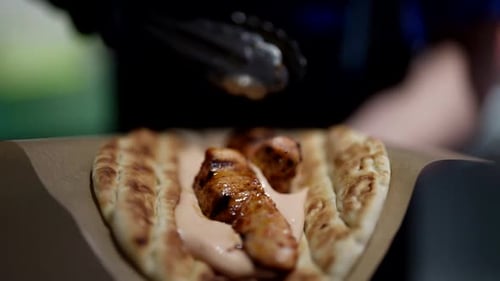 Delicious Street Food in Restaurant Closeup View of Cook Hands Making Pita with Grilled Meat