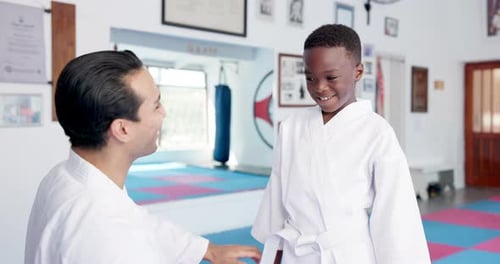Boy and Adult Practice Karate and High Five