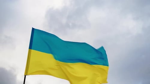 Ukraine Flag Waving in the Wind, Cloudy Sky