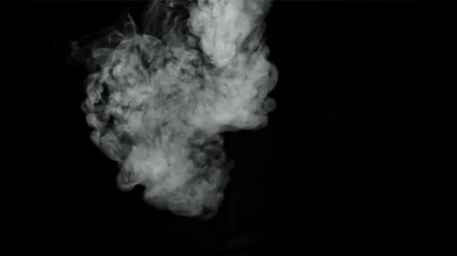 Billowing White Smoke Rising on Black Background