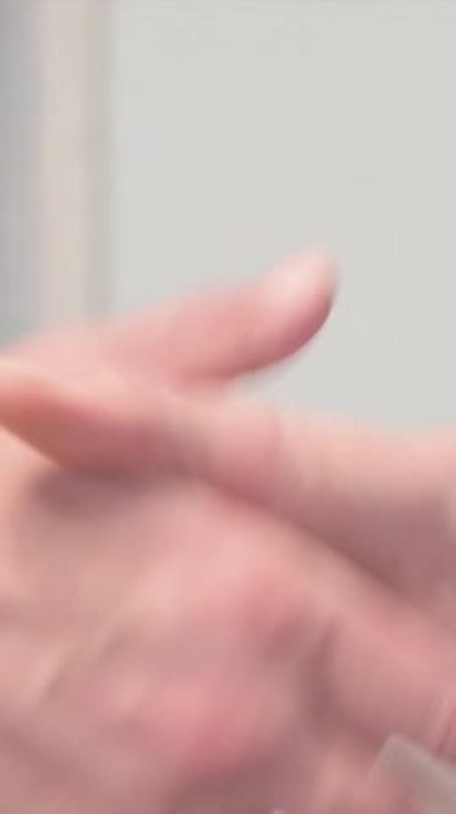 Close Up of Business People Shaking Hand, vertical video