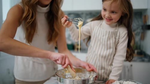 Mother Daughter Hands Creating Dough at Home Close Up. Positive Family Preparing