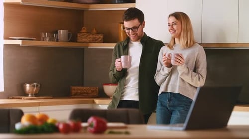 Couple Enjoying Coffee Together in Modern Kitchen