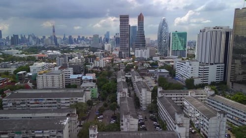 Skyscraper cloudy sky. Best aerial view flight
Bangkok District ari, thailand 2022. fly reverse dro