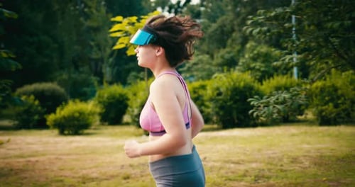 Woman Jogging in Park on Sunny Day