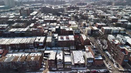 Winter Aerial View of Cityscape with Snow Covered Roofs