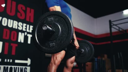 Man Lifting Weights in Gym Close Up Shot