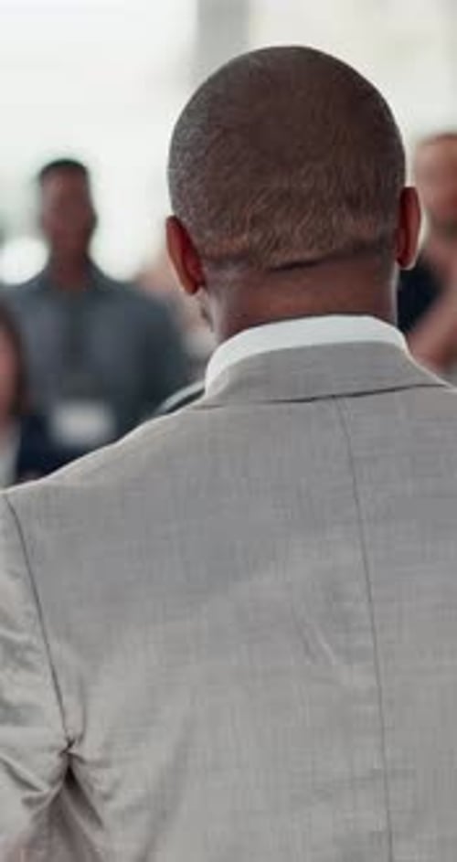 Presentation, conference and speaker with audience applause for discussion, workshop and leader