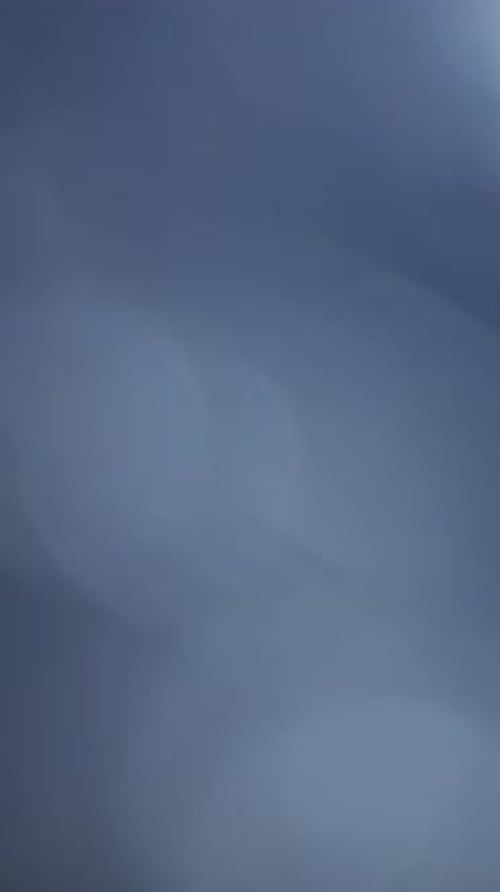 Soft blue bokeh light leak transition for vertical social media stories
