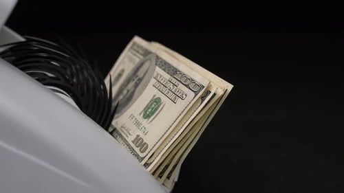 Money Counting Machine Processes US Dollar Bills