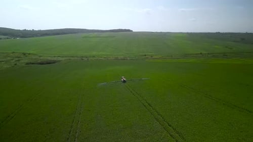 Spray Fertilize On Field With Chemicals In Agriculture Field