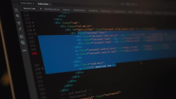 Developer is browsing html code on the computer screen. HTML Web Page ...