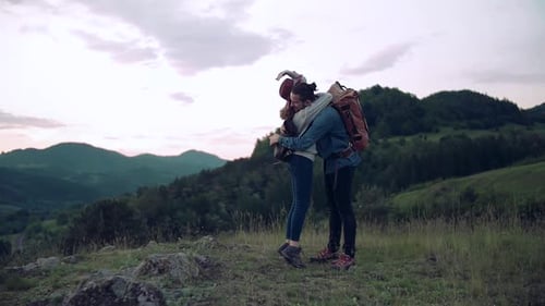 Loving Couple Hugging on Picturesque Mountain Top