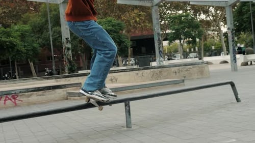 Young Skater Making 360 Flip Jump Performing Kickflip Trick Skateboarder Training in Skatepark