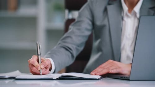 Call center, in headphones. Woman in business formal clothes is working in office