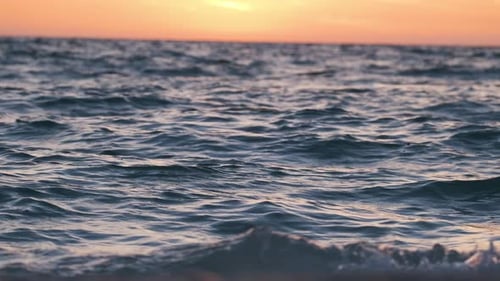 Dramatic Red Ocean Waves at Sunset with Soft Evening Sea Dark Water