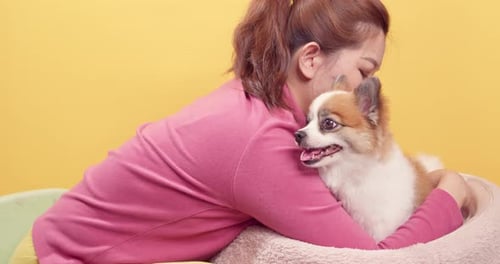 Woman Embraces Her Dog with Love and Tenderness