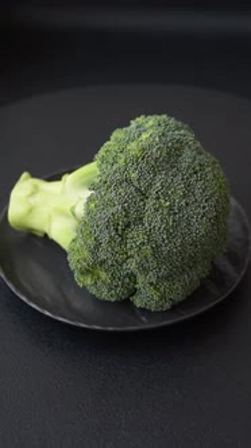 A sprig of raw green broccoli as an ingredient for a healthy meal