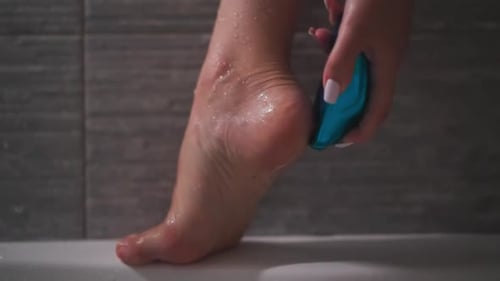 Woman Files Heel with Callous Remover in Bathroom