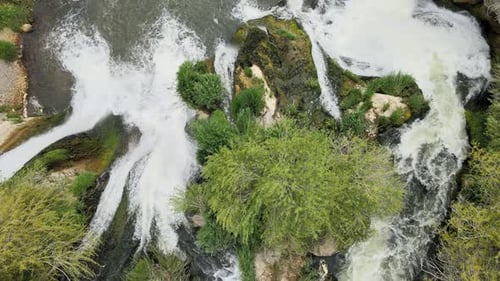 Aerial View of Waterfall in Lush Nature
