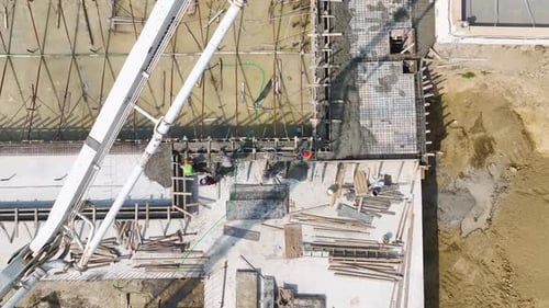Aerial View Workers Pouring Concrete for New Building s Foundation