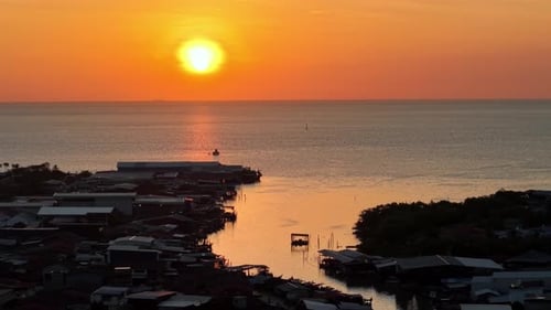 Golden Sunset Over Tanjung Piandang Fishing Village Shoreline