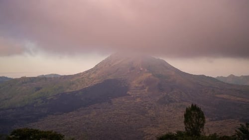 Timelapse of Sunset with Fog Clouds on Batur Volcano in Kintamani Bali Island Indonesia