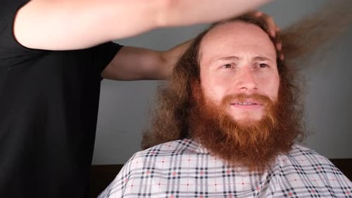 Man Getting His Hair Combed