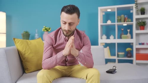 Man Counting Money While Sitting on Couch