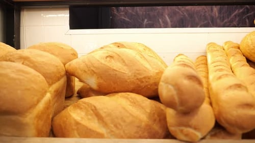 Closeup of Freshly Baked Bread on the Shelf of a Store or Bakery