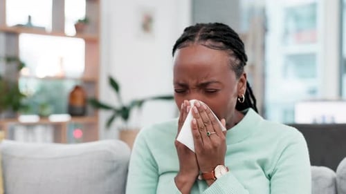 Woman with Cold or Allergies Using Tissue