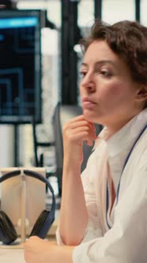 Vertical Video Cheerful Technician Working in Office Using AI Specialized Hardware