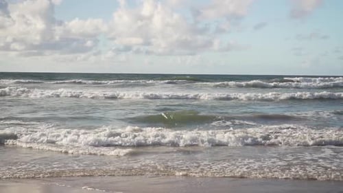 calm sea waves at beach in slow motion.