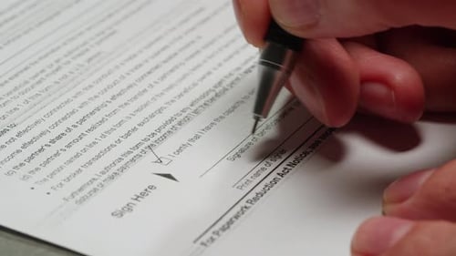 Signing a Paper Form Close Up
