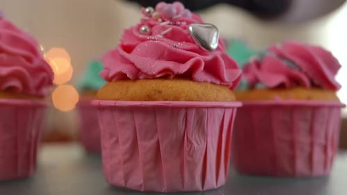 Delicious Cupcakes with Pink and Teal Frosting