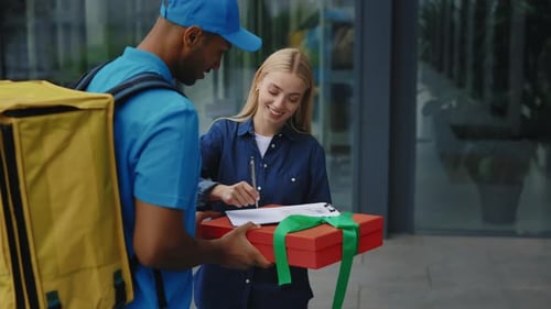 Woman Receives Gift from Delivery Man in City