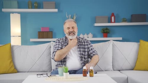 Adult Man with a Sore Throat at Home