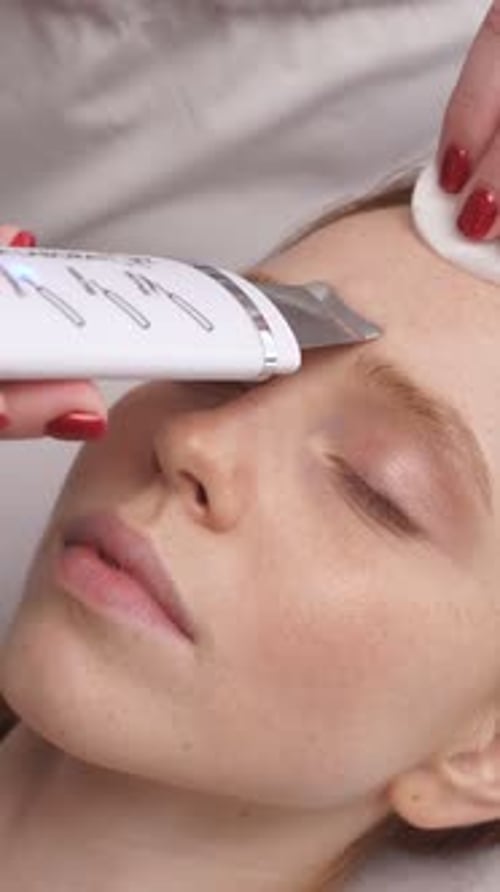 Woman Receives Aesthetic Treatment Close Up at Home