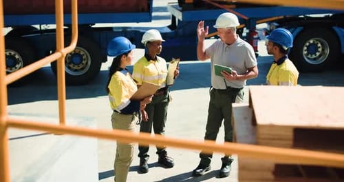 Tablet, meeting and foreman with construction team on site for building, renovation or repair