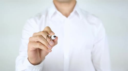 Man Writes Money Laundering on Clear Surface