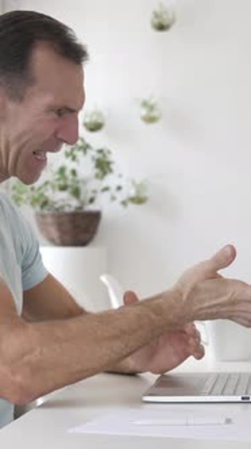 Loss, Frustrated Man Working on Laptop, Vertical Video