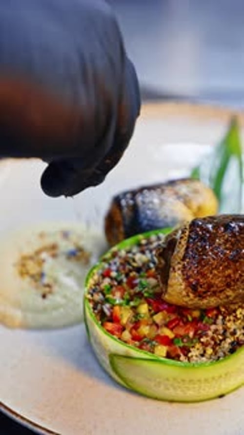 Chef Plating Gourmet Fish Dish in Restaurant
